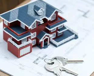 House model with keys representing real estate services
