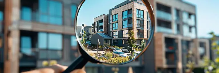 Property sales consultation with keys and handshake